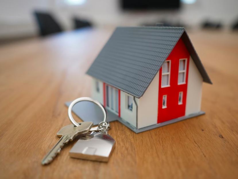 model house with key on table