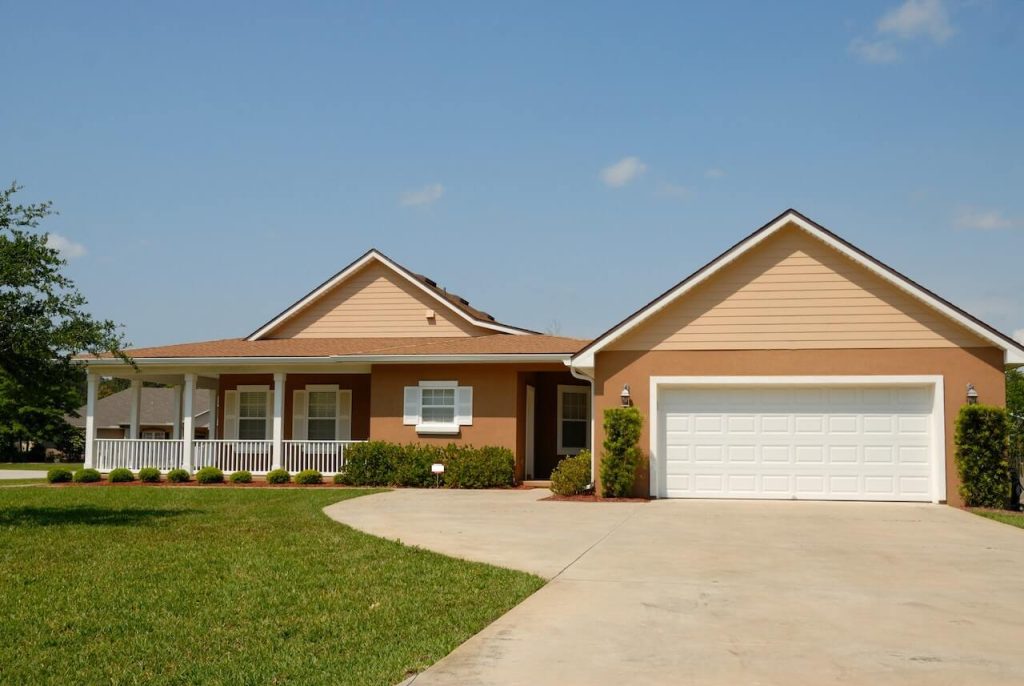 brown bungalow with large garage